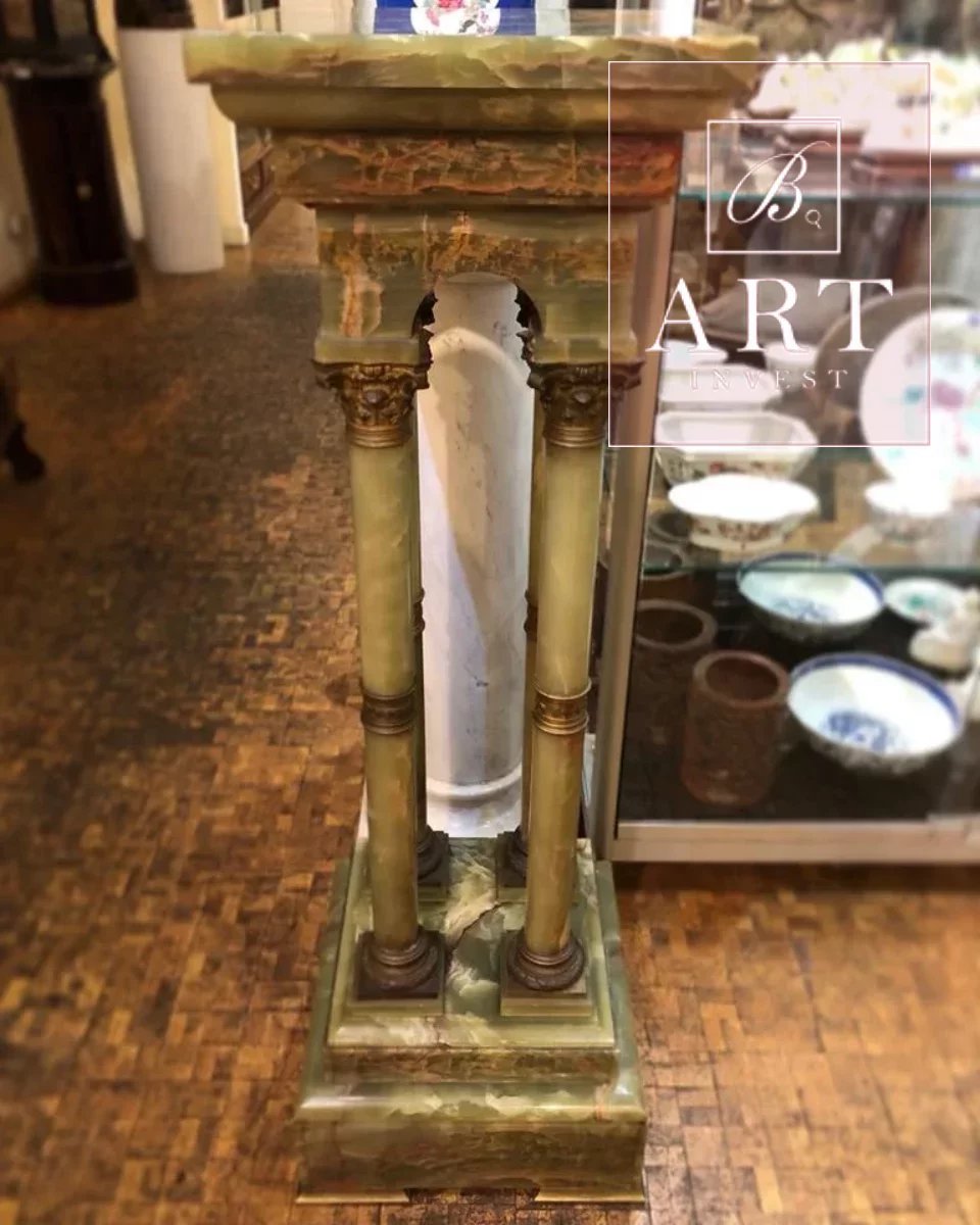 A 19th century onyx and gilded bronze pedestal.